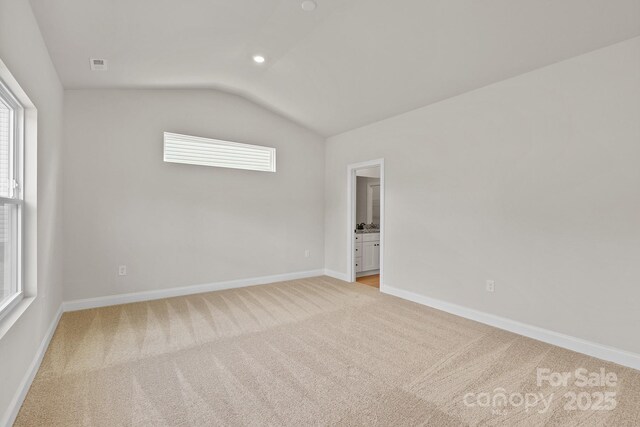7225 Jerimoth Dr, Charlotte, NC 28215 - empty room with lofted ceiling, light carpet, and baseboards