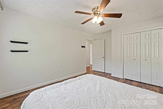 40 Autumn St, Canton, NC 28716 - bedroom with baseboards, dark wood-style floors, a textured ceiling, and a closet