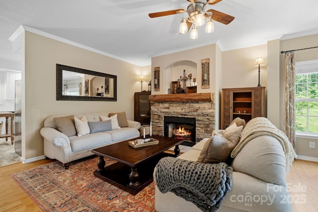 491 Paint Fork Rd, Barnardsville, NC 28709 - living room with wood finished floors, crown molding, ceiling fan, a fireplace, and baseboards