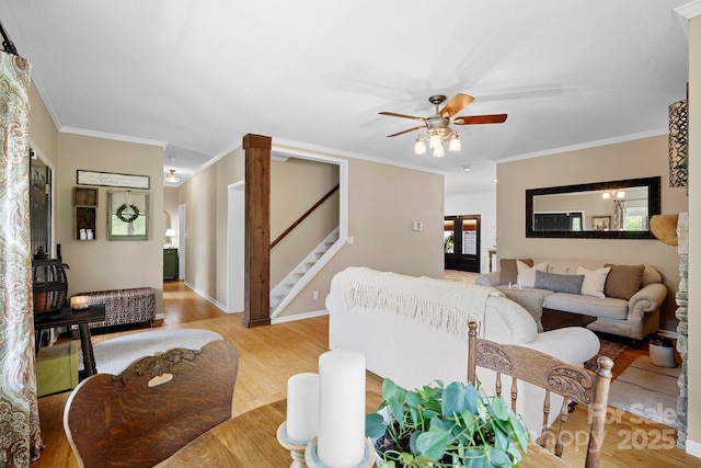 491 Paint Fork Rd, Barnardsville, NC 28709 - living room with light wood-style floors, stairway, ornamental molding, ceiling fan, and baseboards