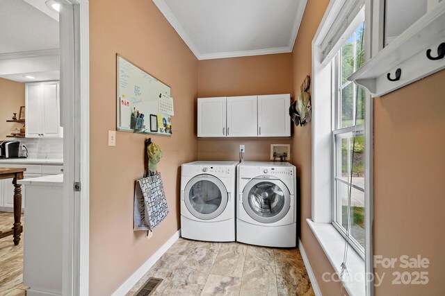491 Paint Fork Rd, Barnardsville, NC 28709 - washroom with crown molding, baseboards, cabinet space, and independent washer and dryer