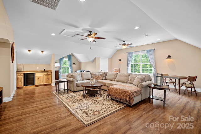 491 Paint Fork Rd, Barnardsville, NC 28709 - living area featuring wine cooler, vaulted ceiling, light wood finished floors, a ceiling fan, and baseboards