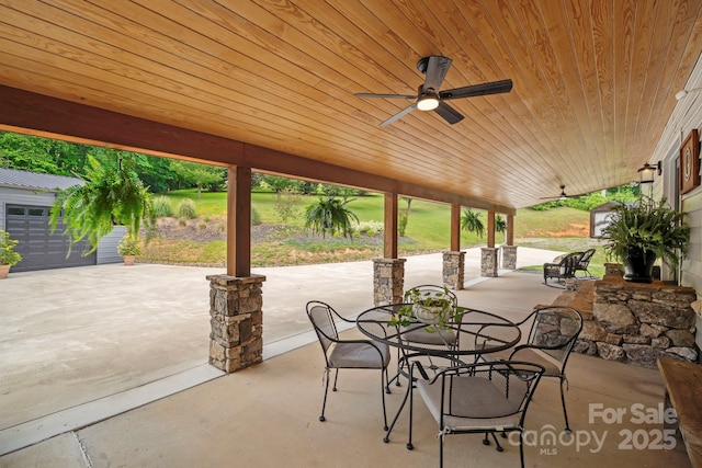 491 Paint Fork Rd, Barnardsville, NC 28709 - view of patio featuring an outbuilding, ceiling fan, and outdoor dining space