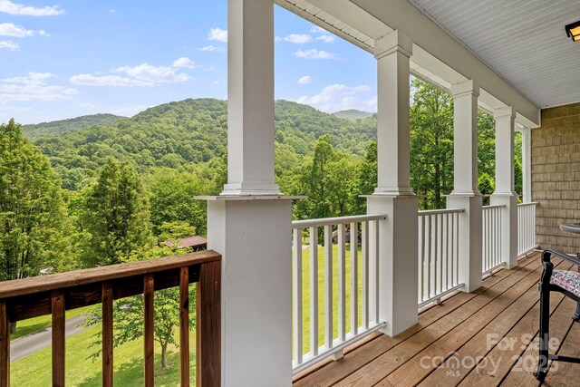 491 Paint Fork Rd, Barnardsville, NC 28709 - wooden terrace with a wooded view and a mountain view