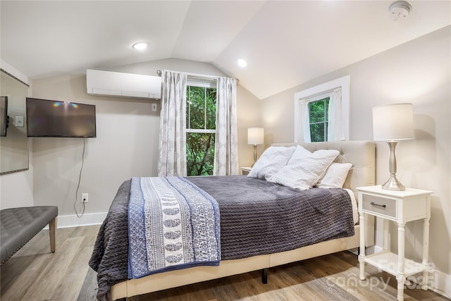 22 Moore Cir, Black Mountain, NC 28711 - bedroom featuring a wall mounted AC, multiple windows, wood finished floors, and lofted ceiling