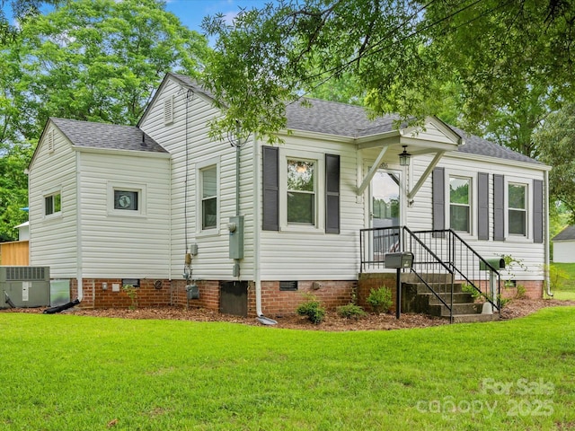 206 Charlotte St, York, SC 29745 - view of front of house with crawl space, a shingled roof, a front lawn, and central air condition unit