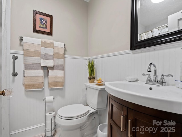 206 Charlotte St, York, SC 29745 - bathroom with vanity, wainscoting, toilet, and a shower with curtain