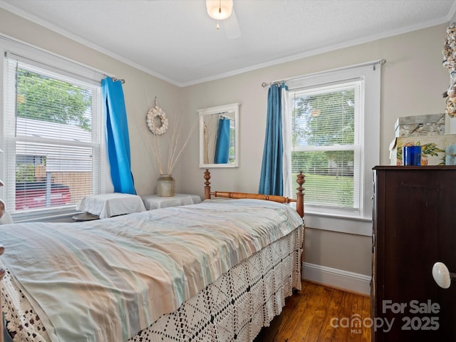 206 Charlotte St, York, SC 29745 - bedroom with baseboards, multiple windows, crown molding, and wood finished floors