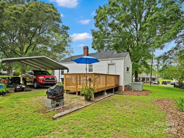 206 Charlotte St, York, SC 29745 - rear view of property featuring a lawn, a carport, a wooden deck, a chimney, and crawl space