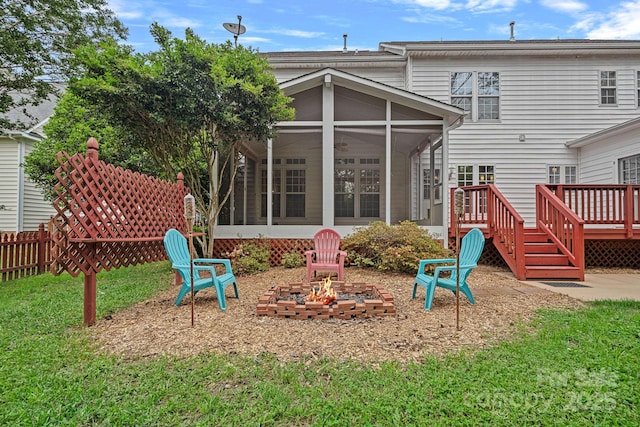 3830 Waters Reach Ln, Indian Trail, NC 28079 - rear view of property featuring a sunroom, an outdoor fire pit, and a wooden deck