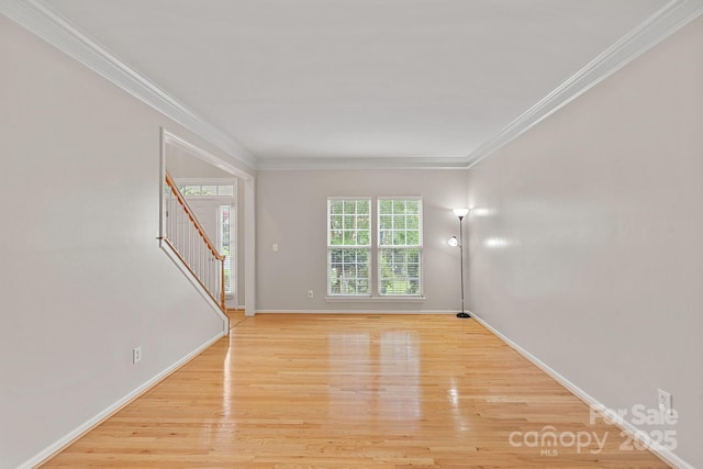 3830 Waters Reach Ln, Indian Trail, NC 28079 - unfurnished room with stairs, ornamental molding, and light wood finished floors