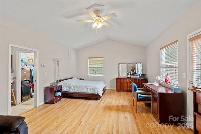 3830 Waters Reach Ln, Indian Trail, NC 28079 - bedroom featuring light wood-style flooring, vaulted ceiling, a spacious closet, and ceiling fan