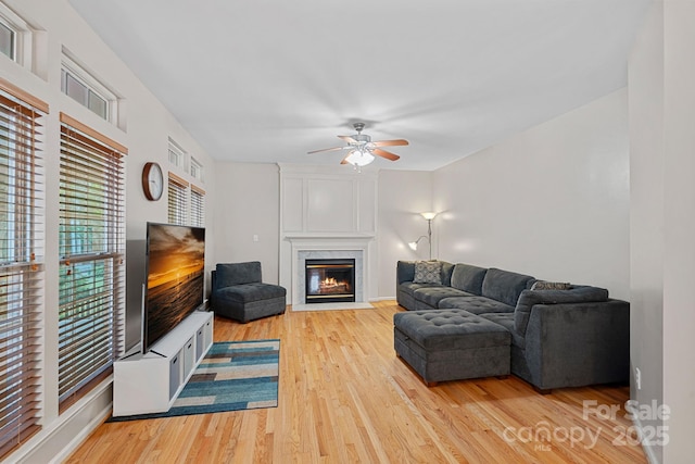 3830 Waters Reach Ln, Indian Trail, NC 28079 - living room with a ceiling fan, light wood-style floors, and a premium fireplace