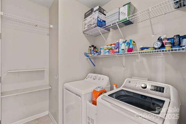 3830 Waters Reach Ln, Indian Trail, NC 28079 - laundry area with washing machine and clothes dryer and baseboards