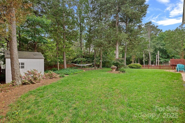 3830 Waters Reach Ln, Indian Trail, NC 28079 - view of yard with a storage unit and view of wooded area