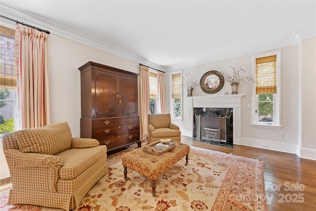 1728 Shadow Forest Dr, Matthews, NC 28105 - living area featuring wood finished floors, a premium fireplace, baseboards, and crown molding