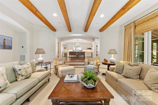 1728 Shadow Forest Dr, Matthews, NC 28105 - living area with arched walkways, recessed lighting, beam ceiling, and baseboards