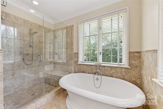 1728 Shadow Forest Dr, Matthews, NC 28105 - bathroom with a freestanding bath, a stall shower, tile walls, ornamental molding, and recessed lighting