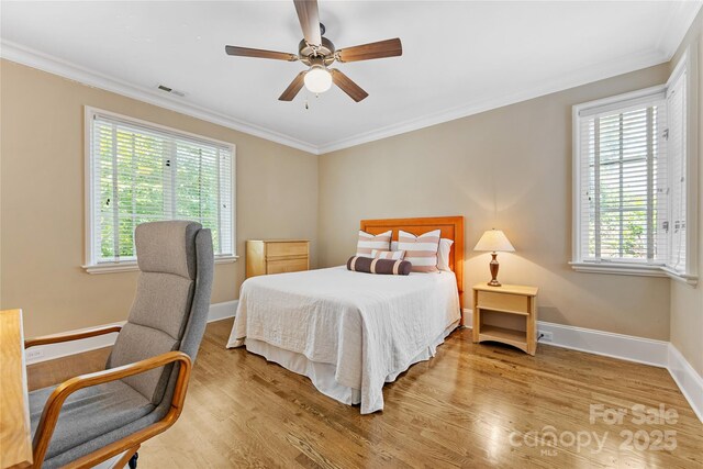 1728 Shadow Forest Dr, Matthews, NC 28105 - bedroom featuring ornamental molding, wood finished floors, baseboards, and a ceiling fan
