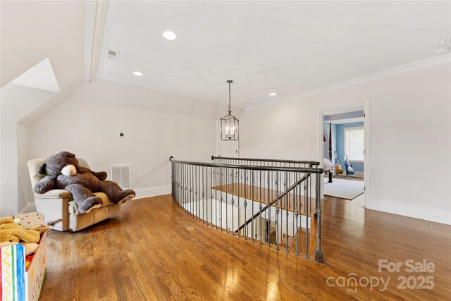 1728 Shadow Forest Dr, Matthews, NC 28105 - hallway with an upstairs landing, wood finished floors, baseboards, recessed lighting, and crown molding
