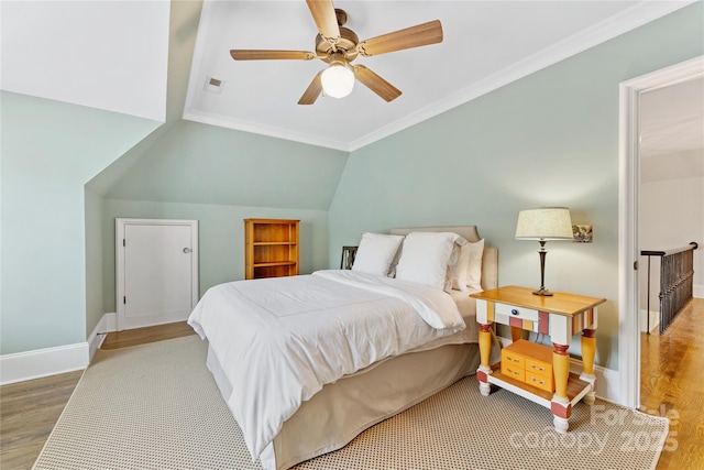 1728 Shadow Forest Dr, Matthews, NC 28105 - bedroom featuring wood finished floors, ornamental molding, baseboards, ceiling fan, and vaulted ceiling