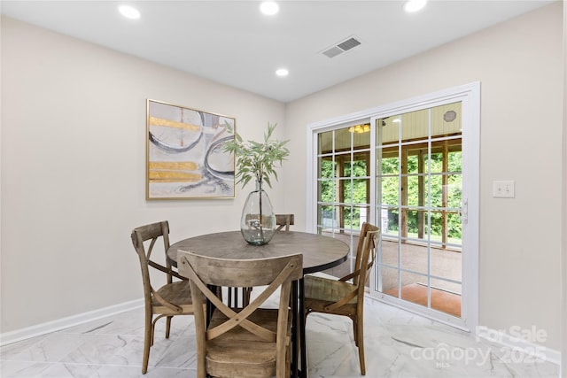 3008 Cornflower Ln, Indian Trail, NC 28079 - dining area with light marble finish flooring and recessed lighting