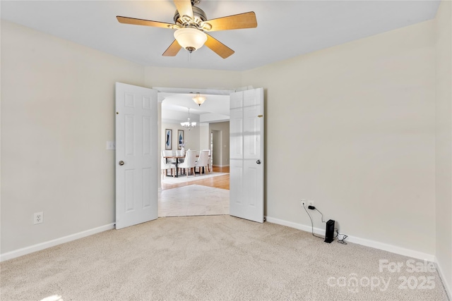 3008 Cornflower Ln, Indian Trail, NC 28079 - carpeted empty room featuring a chandelier and a ceiling fan