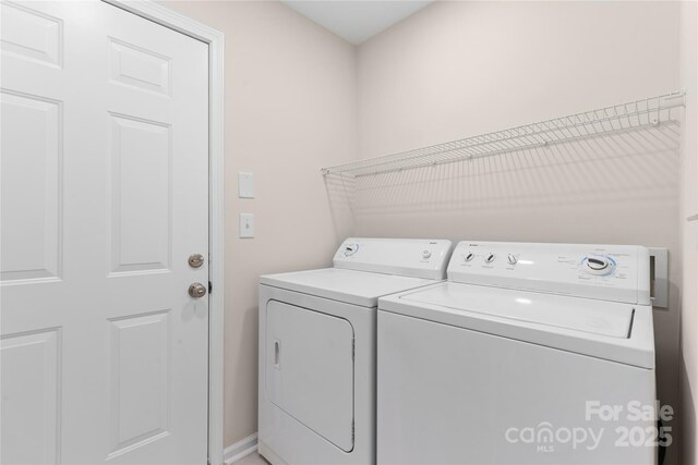 3008 Cornflower Ln, Indian Trail, NC 28079 - laundry area featuring washing machine and dryer