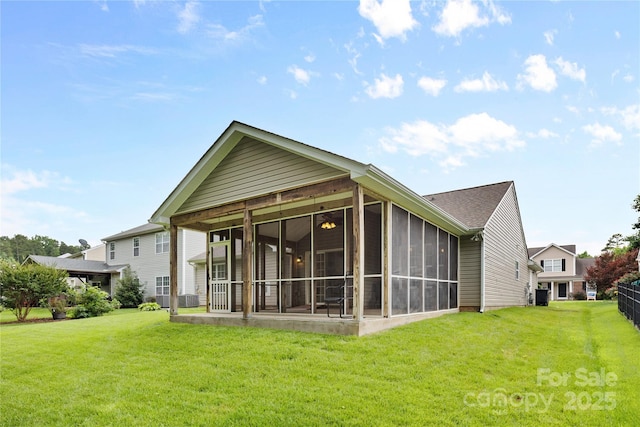 3008 Cornflower Ln, Indian Trail, NC 28079 - rear view of house with a lawn and a sunroom