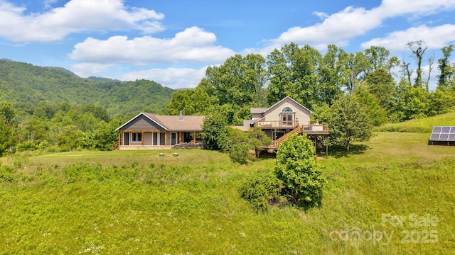 540 Upper Paw Paw Rd, Marshall, NC 28753 - view of front of home with a deck and a view of trees