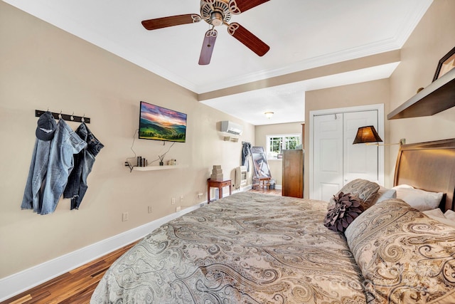 540 Upper Paw Paw Rd, Marshall, NC 28753 - bedroom with baseboards, wood finished floors, crown molding, a closet, and a wall unit AC
