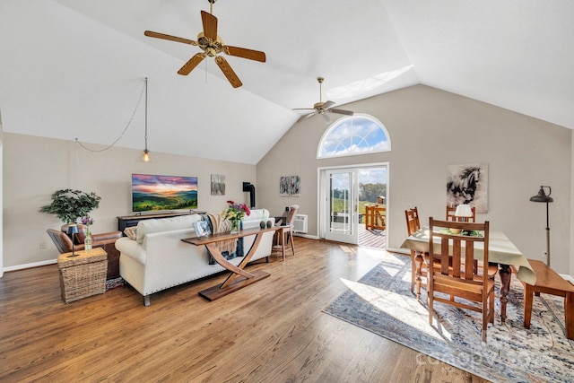 540 Upper Paw Paw Rd, Marshall, NC 28753 - living area with vaulted ceiling, a ceiling fan, light wood-style flooring, and baseboards