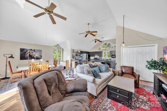 540 Upper Paw Paw Rd, Marshall, NC 28753 - living area with light wood-style floors, ceiling fan, and high vaulted ceiling
