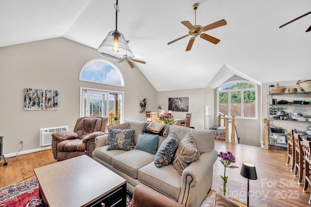 540 Upper Paw Paw Rd, Marshall, NC 28753 - living room featuring a ceiling fan, wood finished floors, lofted ceiling, and an AC wall unit