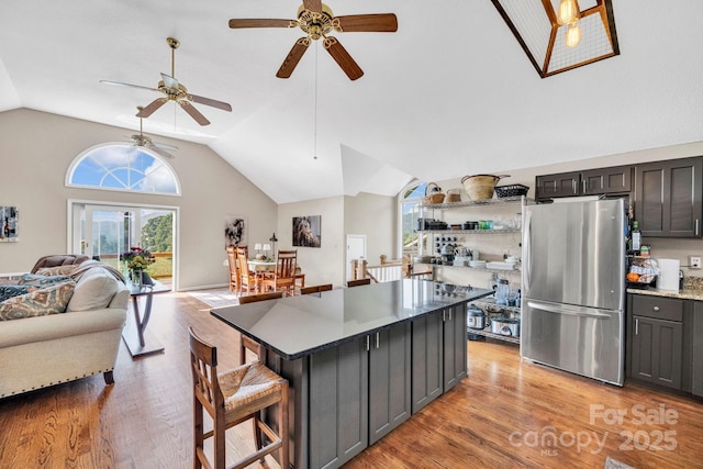 540 Upper Paw Paw Rd, Marshall, NC 28753 - kitchen featuring freestanding refrigerator, light wood finished floors, healthy amount of natural light, lofted ceiling, and a ceiling fan