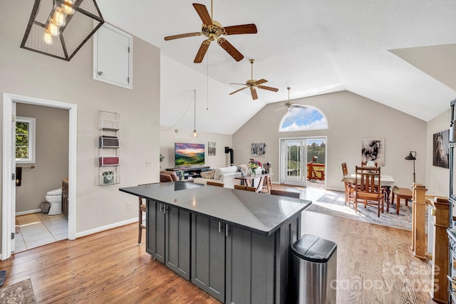 540 Upper Paw Paw Rd, Marshall, NC 28753 - kitchen featuring ceiling fan, a center island, light wood-type flooring, vaulted ceiling, and open floor plan