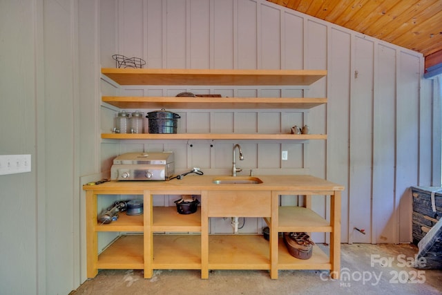 540 Upper Paw Paw Rd, Marshall, NC 28753 - kitchen featuring a sink, open shelves, and light countertops