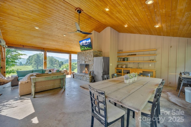 540 Upper Paw Paw Rd, Marshall, NC 28753 - dining room with wood ceiling, finished concrete floors, an outdoor stone fireplace, a ceiling fan, and recessed lighting