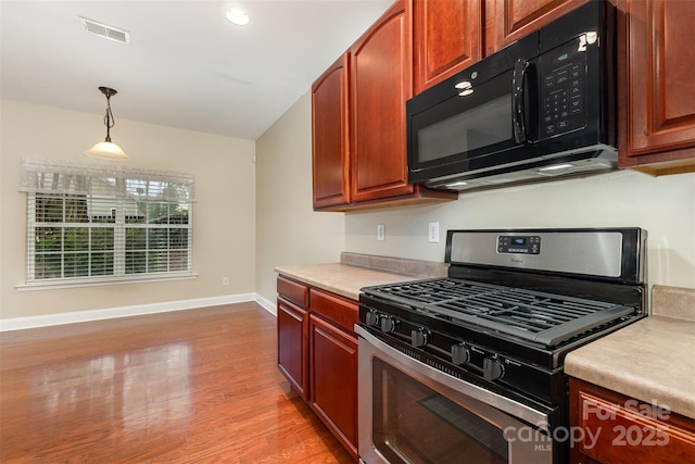 237 Lylic Woods Dr, Fort Mill, SC 29715 - kitchen with stainless steel gas range oven, black microwave, baseboards, light countertops, and recessed lighting