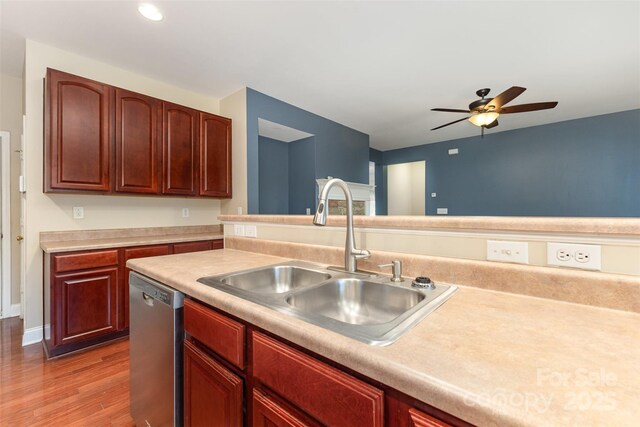 237 Lylic Woods Dr, Fort Mill, SC 29715 - kitchen with dishwasher, a sink, a ceiling fan, light countertops, and light wood finished floors