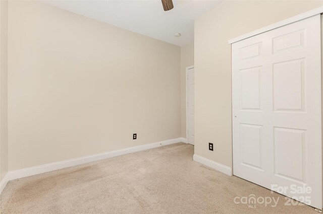 237 Lylic Woods Dr, Fort Mill, SC 29715 - unfurnished bedroom with light carpet, baseboards, and ceiling fan