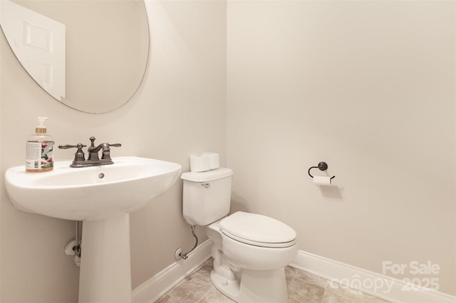 237 Lylic Woods Dr, Fort Mill, SC 29715 - half bathroom with baseboards, toilet, and a sink