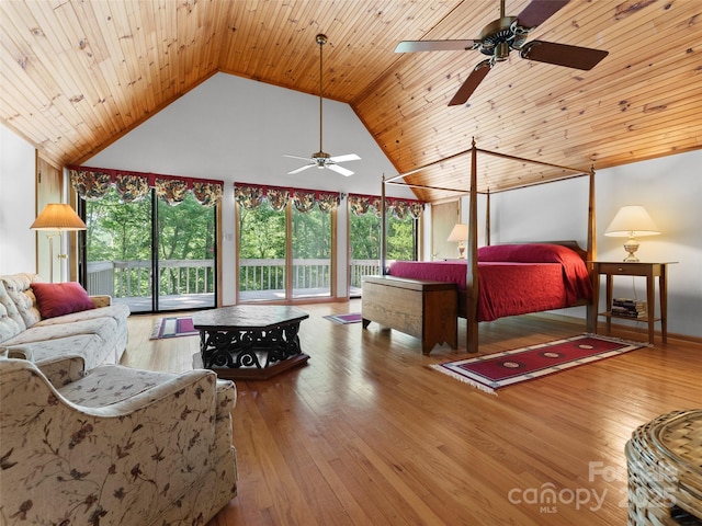 43 Hungryneck Hollow Ln, Saluda, NC 28773 - bedroom with high vaulted ceiling, access to exterior, and hardwood / wood-style flooring