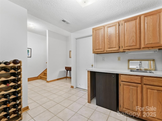43 Hungryneck Hollow Ln, Saluda, NC 28773 - kitchen featuring a sink, light countertops, a textured ceiling, baseboards, and light tile patterned floors
