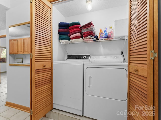 43 Hungryneck Hollow Ln, Saluda, NC 28773 - laundry room with washer and dryer, light tile patterned flooring, and a textured ceiling