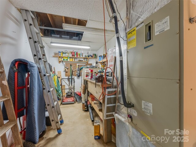 43 Hungryneck Hollow Ln, Saluda, NC 28773 - garage with a workshop area and heating unit