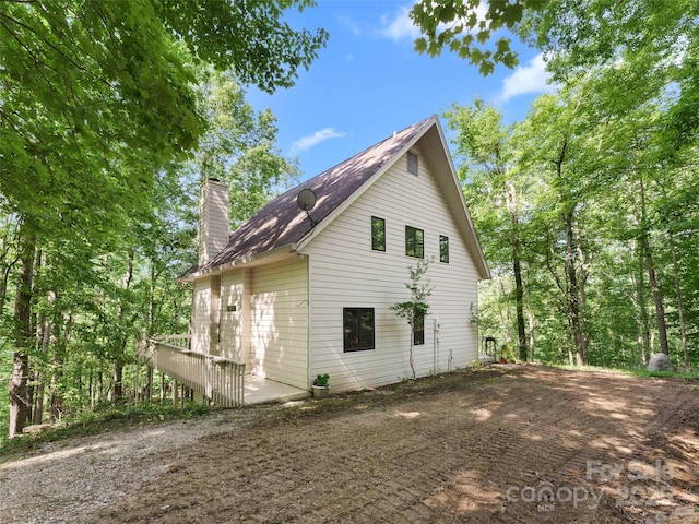 43 Hungryneck Hollow Ln, Saluda, NC 28773 - view of home's exterior with a chimney
