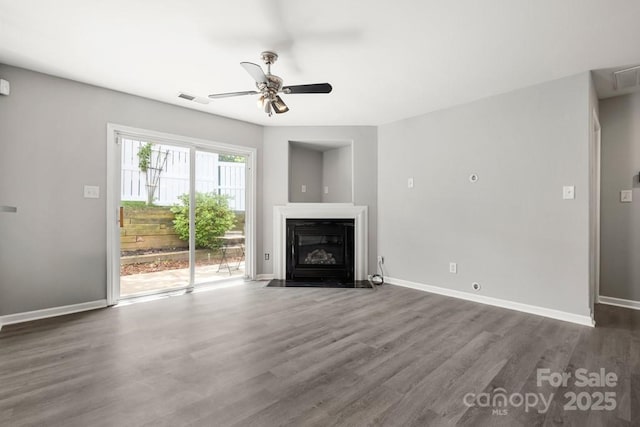 7315 Gasper Ln, Fort Mill, SC 29707 - unfurnished living room featuring ceiling fan, wood finished floors, baseboards, and a fireplace with flush hearth
