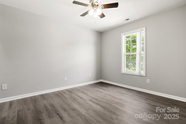 7315 Gasper Ln, Fort Mill, SC 29707 - spare room featuring dark wood-type flooring, ceiling fan, and baseboards