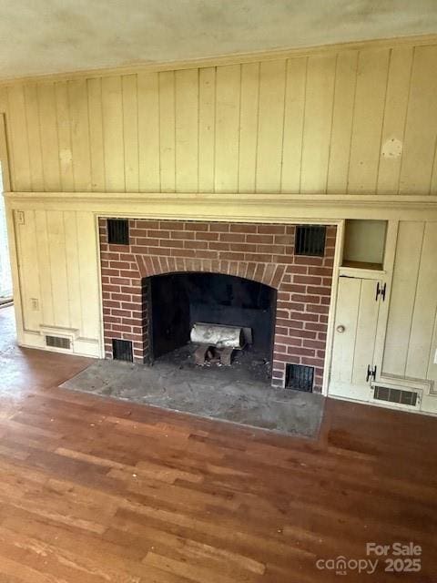 59 Laurel Ln, Black Mountain, NC 28711 - detailed view of a fireplace, wood finished floors, and wooden walls